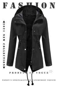 Detail of black hooded waterproof windbreaker with drawstring waist and zip-button closure