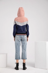 Back view of women's hooded jacket featuring pink and blue patchwork and V-shaped seam detail