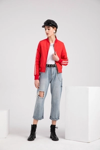 Detail of red bomber jacket with standing collar and sporty double white sleeve stripes