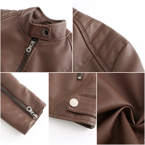 Détails d'une veste en similicuir marron avec col montant, zips et épaules matelassées