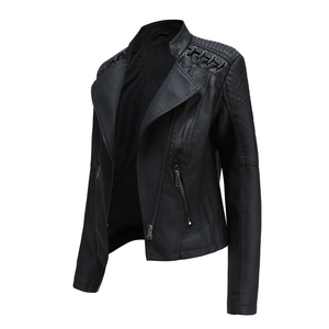 Detail of black biker leather jacket with quilted shoulders and metallic ring straps