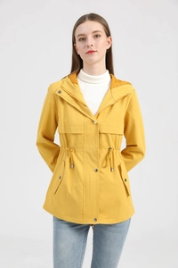 Detail of yellow hooded raincoat featuring adjustable drawstring waist and flap pockets