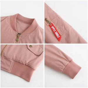 Detail of pink bomber jacket showing elastic ribbed cuffs and red Apple Smile tag