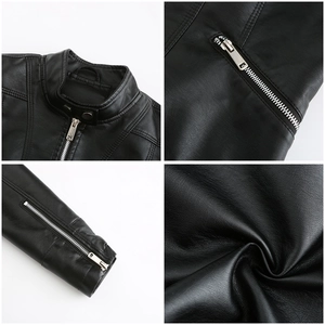Detail view of women's black leather jacket featuring stand collar and zipper cuffs