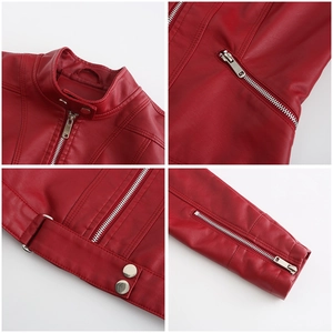 Detail view of red leather jacket featuring stand collar, zip pockets, and metallic hardware