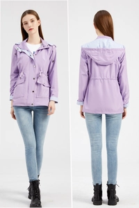 Detail of purple windbreaker featuring detachable hood and blue striped lining accents