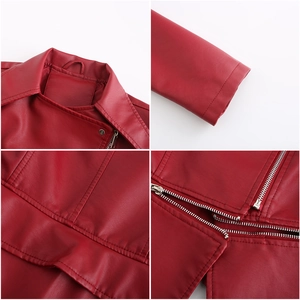 Detail of red faux leather jacket showing collar, stitching, and metal zipper closure
