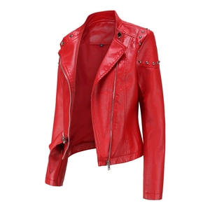 Detail of silver rivets on collar and shoulders of red faux leather biker jacket