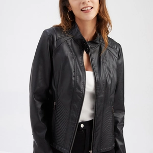 Detail of black faux leather jacket showing metallic zipper and fine quilted stitching