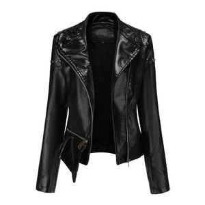 Close-up of black biker leather jacket with silver studs on the collar and shoulder
