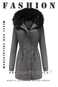 Detailed view of women's dark grey parka featuring thick black faux fur trim and drawstring waist