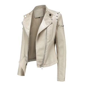 Close-up of beige faux leather jacket featuring silver studs and metallic zippers