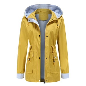 Detail of yellow hooded windbreaker featuring blue striped lining and adjustable drawstring