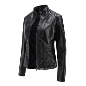 Detailed view of women's black faux leather biker jacket with quilted shoulder texture