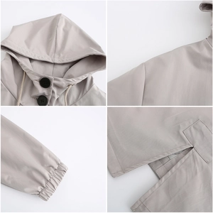 Detail view of water-resistant hooded windbreaker featuring elastic cuffs and flap pockets