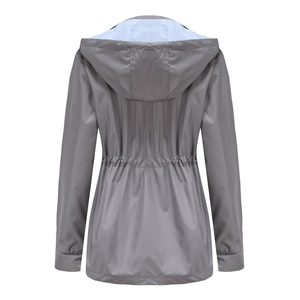 Detail view of grey trench coat back with waist pleats and striped hood lining