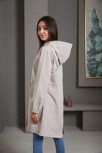 Detailed side view of water-resistant hooded trench coat with drawstring waist and elastic cuffs