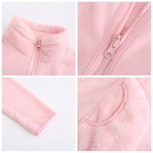 Detail of pink fleece jacket showing soft texture, stand collar and zipper closure