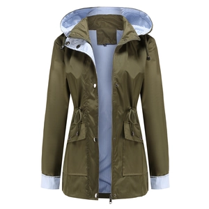 Olive green hooded trench coat detail showing striped lining and adjustable waist drawstring
