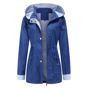 Detail of navy blue windbreaker with striped lining, drawstring waist and metal zipper