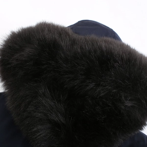 Detailed macro view of high-quality faux fur collar trim on winter hooded parka jacket