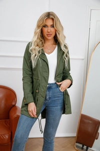 Detail view of army green cotton trench coat with drawstring waist and stand collar