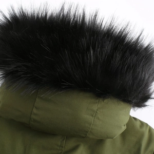 Detail of army green parka with a thick black faux fur collar on the hood