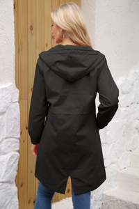 Rear view of black waterproof long parka featuring drawstring waist and fishtail hem detail