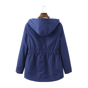 Detail of navy blue winter parka featuring adjustable drawstring waist and ribbed cuffs