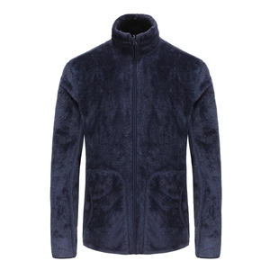 Detail of navy blue fleece jacket showing the high-density polar fabric and zipper