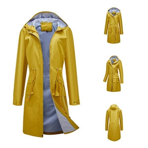 Detail of yellow hooded raincoat featuring blue striped lining and adjustable drawstring waist
