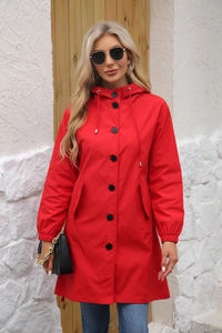 Front view of women's red hooded raincoat with black buttons and adjustable drawstring hood