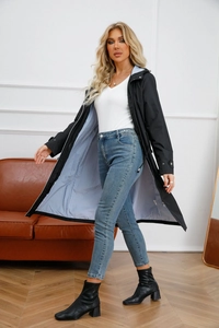Detail of black hooded trench coat with premium blue and white striped inner lining