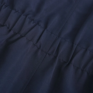 Detailed close-up of elastic drawstring waist on dark blue winter parka jacket