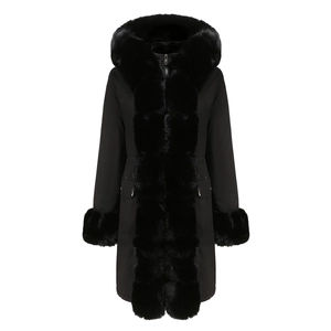 Detailed view of women's black parka featuring plush faux fur lining and hood trim