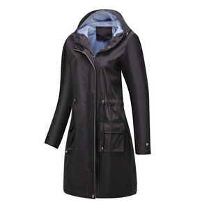 Detail of black waterproof trench coat with blue and white striped lining and drawstring