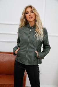 Detail of dark green faux leather jacket featuring stand collar and metal zipper pockets
