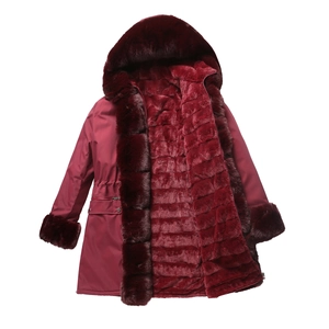 Detailed view of wine red winter parka with thick faux fur lining and drawstring waist