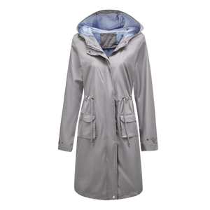 Detail view of grey hooded windbreaker featuring blue striped lining and adjustable drawstring