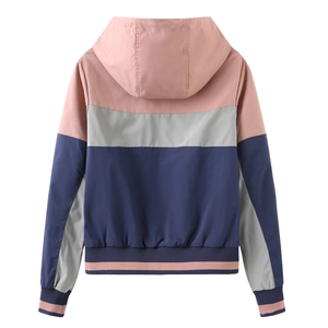 Back view of a women's lightweight hooded windbreaker with pink, grey and navy color-blocking