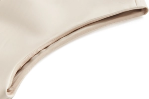 Vue macro détaillée du cuir PU crème de haute qualité avec des coutures et textures fines