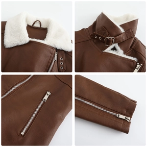 Détails d'une veste en simili cuir marron avec col en fausse fourrure blanche et boucles