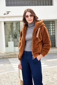 Detailed texture of brown faux fur hooded jacket with zipper and decorative drawstrings