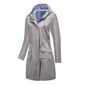 Detail of grey hooded trench coat featuring blue striped lining and adjustable drawstring waist