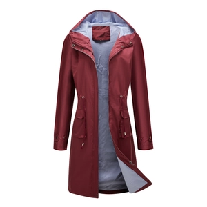 Detail of burgundy windbreaker featuring blue striped lining and adjustable drawstring waist