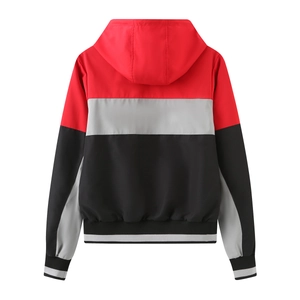 Rear view of tricolor hooded jacket featuring red, grey, and black paneled polyester fabric