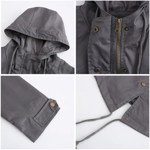 Detail view of cotton windbreaker featuring metal zippers, snaps and adjustable drawstrings