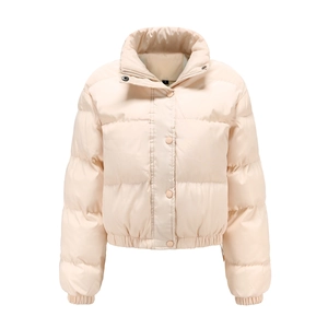 Detail of beige puffer jacket showing zip fastening, press studs and elasticated hemline