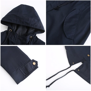 Detail view of cotton windbreaker featuring adjustable drawstring hood and gold metal buttons