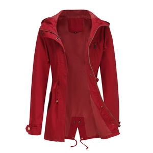 Detail of red hooded cotton trench coat showing zipper closure and drawstring waist